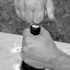 Image showing Black and white Bottle opening