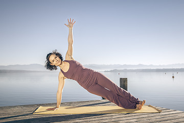 Image showing yoga woman at the lake