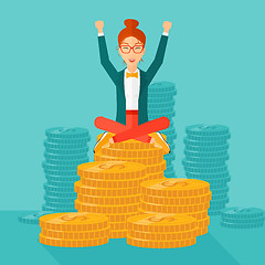 Image showing  Happy business woman sitting on coins.