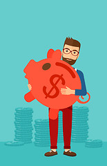 Image showing Man carrying piggy bank.