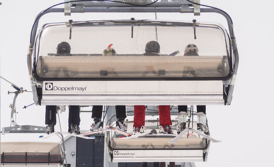 Image showing A view of people sitting on the cableway 