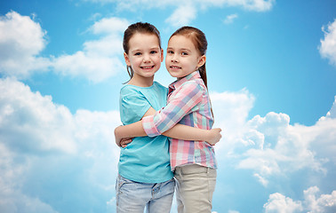 Image showing happy smiling little girls hugging