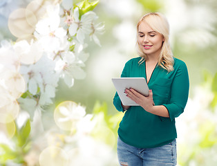 Image showing smiling woman with tablet pc computer