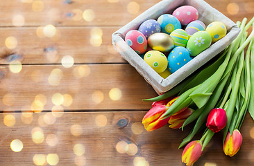 Image showing close up of colored easter eggs and flowers