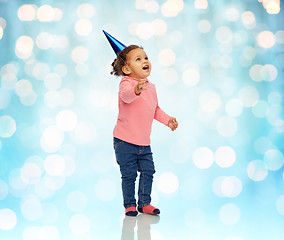 Image showing happy little baby girl with birthday party hat