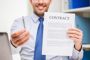 Image showing close up of businessman holding contract document