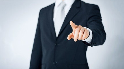 Image showing close up of man pointing finger to something