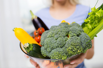 Image showing close up of woman holding vegetables in bowl