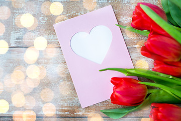 Image showing close up of tulips and greeting card with heart