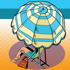 Image showing Girl under a beach umbrella vacation at sea