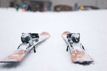 Image showing Skis parked about hotel in the mountains.