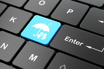 Image showing Security concept: Family And Umbrella on computer keyboard background