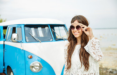 Image showing smiling young hippie woman in minivan car