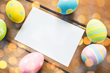 Image showing close up of easter eggs and blank white paper