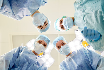 Image showing group of surgeons in operating room at hospital