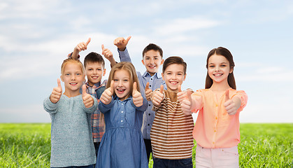 Image showing happy children showing thumbs up