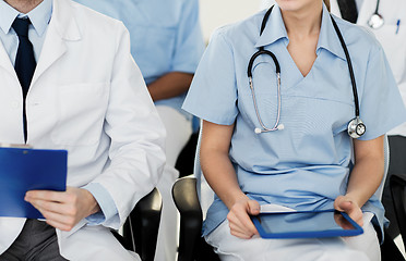 Image showing close up of happy doctors at seminar or hospital