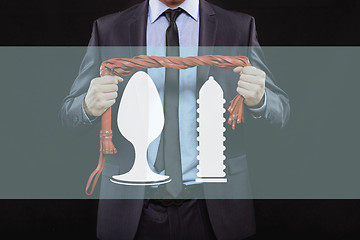 Image showing man in business suit with chained hands. handcuffs for sex games. concept of erotic entertainment.