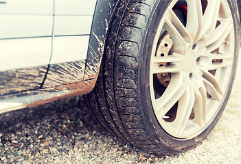 Image showing close up of dirty car wheel on ground