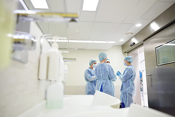 Image showing group of surgeons in operating room at hospital