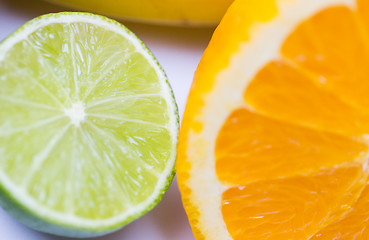 Image showing close up of fresh juicy orange and lime