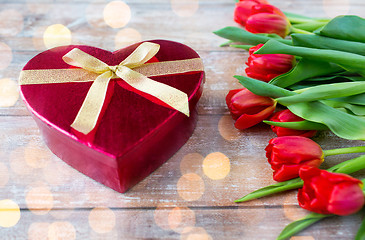 Image showing close up of red tulips and chocolate box