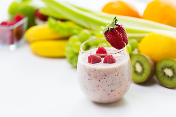 Image showing close up of glass with milk shake and fruits