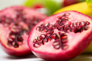 Image showing close up of ripe pomegranate and other fruits