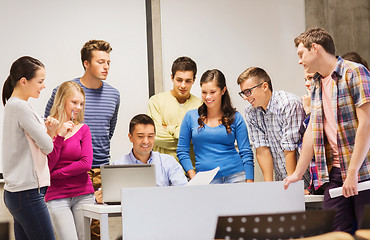 Image showing group of students and teacher with laptop