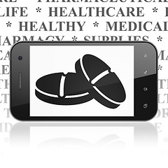 Image showing Health concept: Smartphone with Pills on display