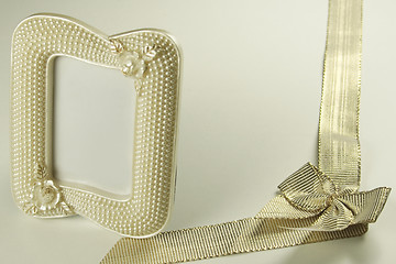 Image showing golden ribbon and pearl picture frame