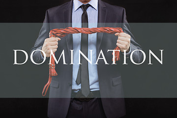 Image showing man in business suit with chained hands. handcuffs for sex games. concept of erotic entertainment.