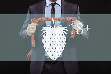 Image showing man in business suit with chained hands. handcuffs for sex games. concept of erotic entertainment.