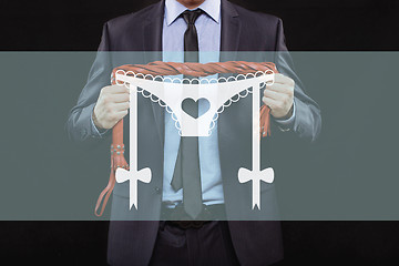 Image showing man in business suit with chained hands. handcuffs for sex games. concept of erotic entertainment.