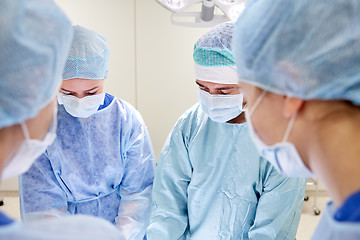 Image showing group of surgeons in operating room at hospital