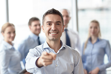 Image showing group of smiling businesspeople meeting in office