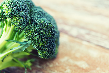 Image showing close up of broccoli on wooden table