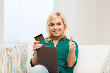 Image showing happy woman with tablet pc and credit card