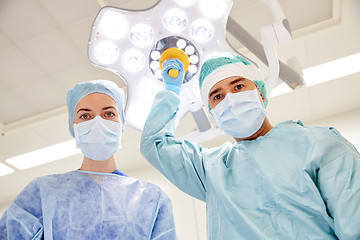 Image showing group of surgeons in operating room at hospital