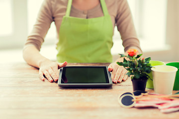 Image showing close up of woman or gardener with tablet pc