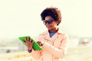 Image showing happy young woman or teenage girl with tablet pc