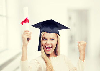 Image showing student in graduation cap with certificate