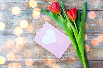 Image showing close up of tulips and greeting card with heart