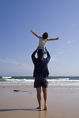 Image showing Father and son at the beach