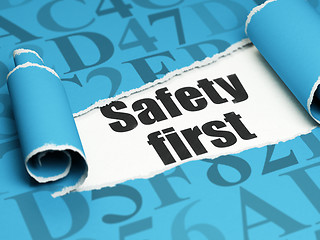 Image showing Safety concept: black text Safety First under the piece of  torn paper