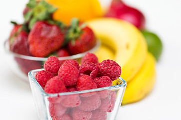 Image showing close up of fresh raspberry and fruits on table