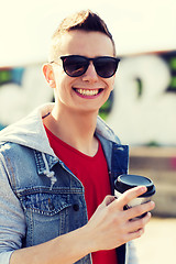 Image showing smiling young man or boy drinking coffee