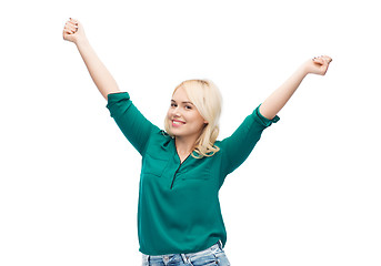 Image showing smiling young woman in shirt and jeans