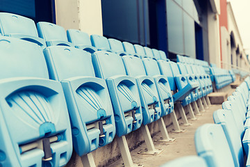 Image showing rows with folded seats of bleachers on stadium