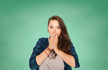 Image showing scared teenage student girl over green board